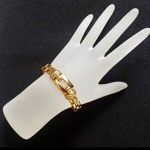 1980-S NINA RICCI SIGNED VINTAGE GOLD TONE CHAIN BRACELET.